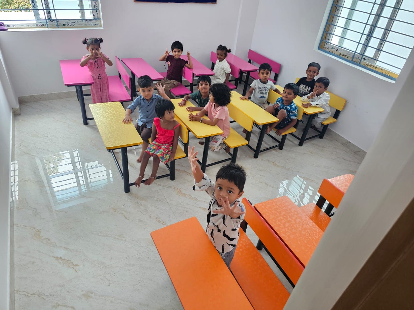 Happy kids waving