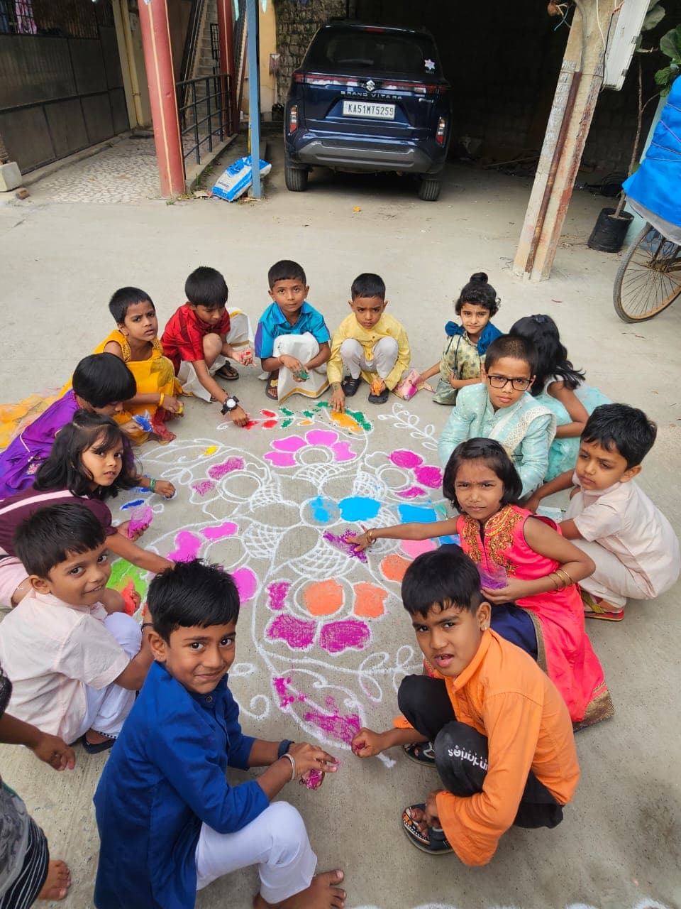Kids making rangoli